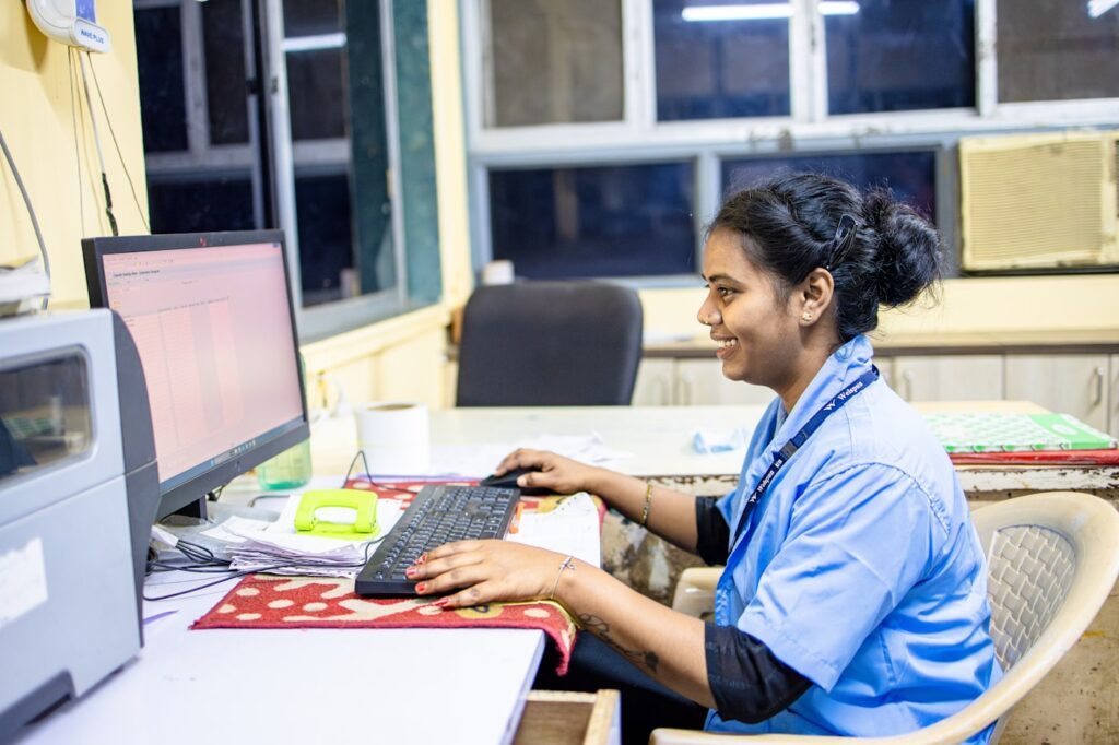 Indian professional working on business website in Pune office